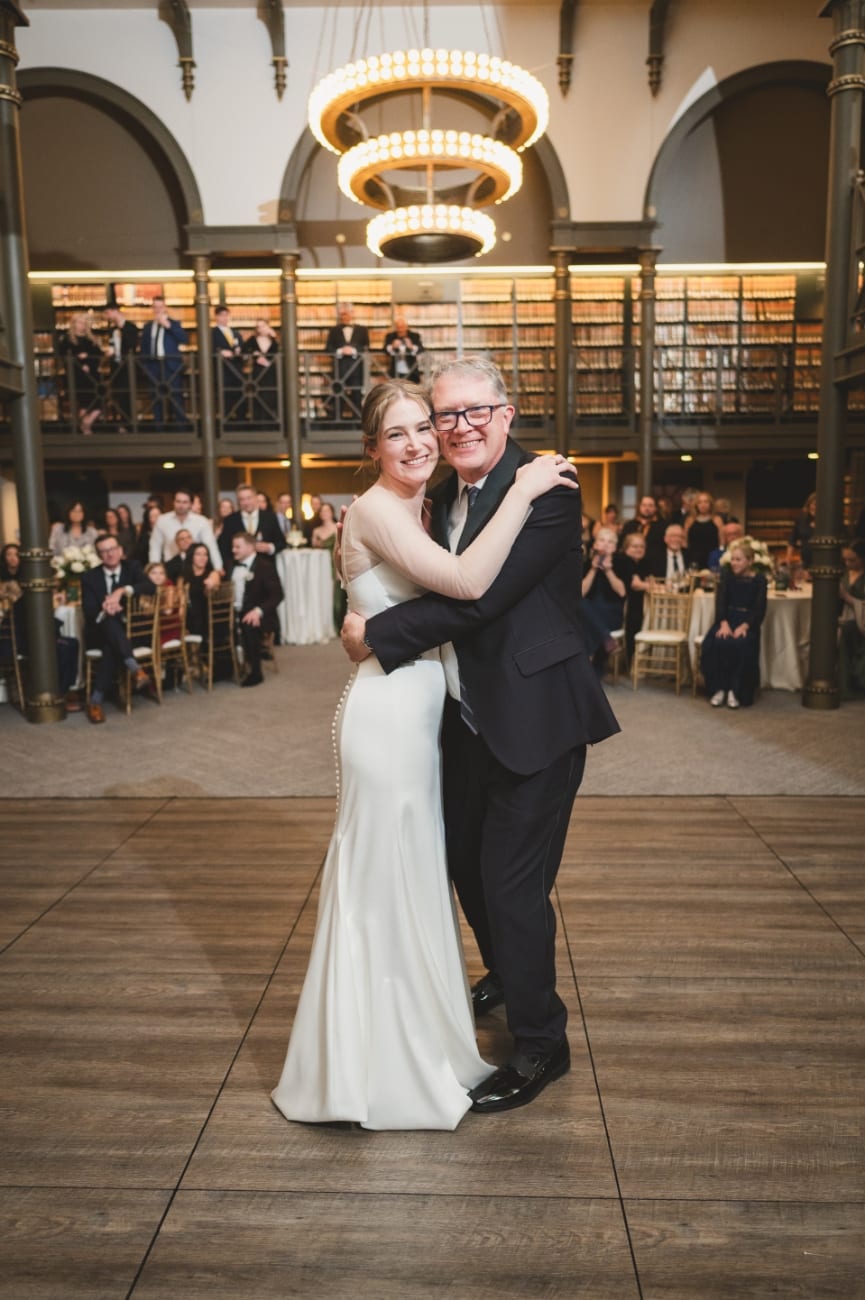 A first dance beneath the ring chandeliers