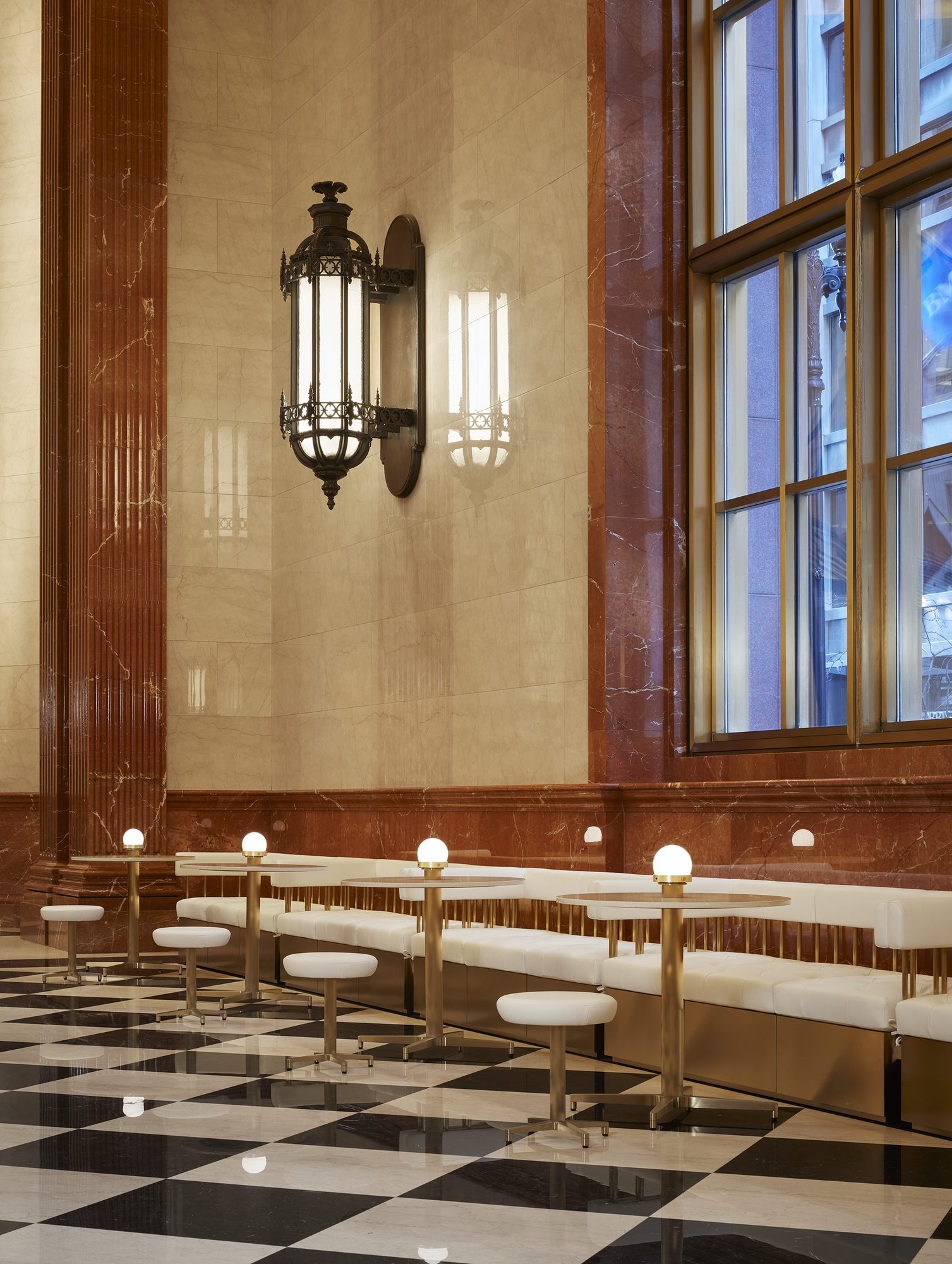 The Lobby set with lounge seating on the checkered marble floor