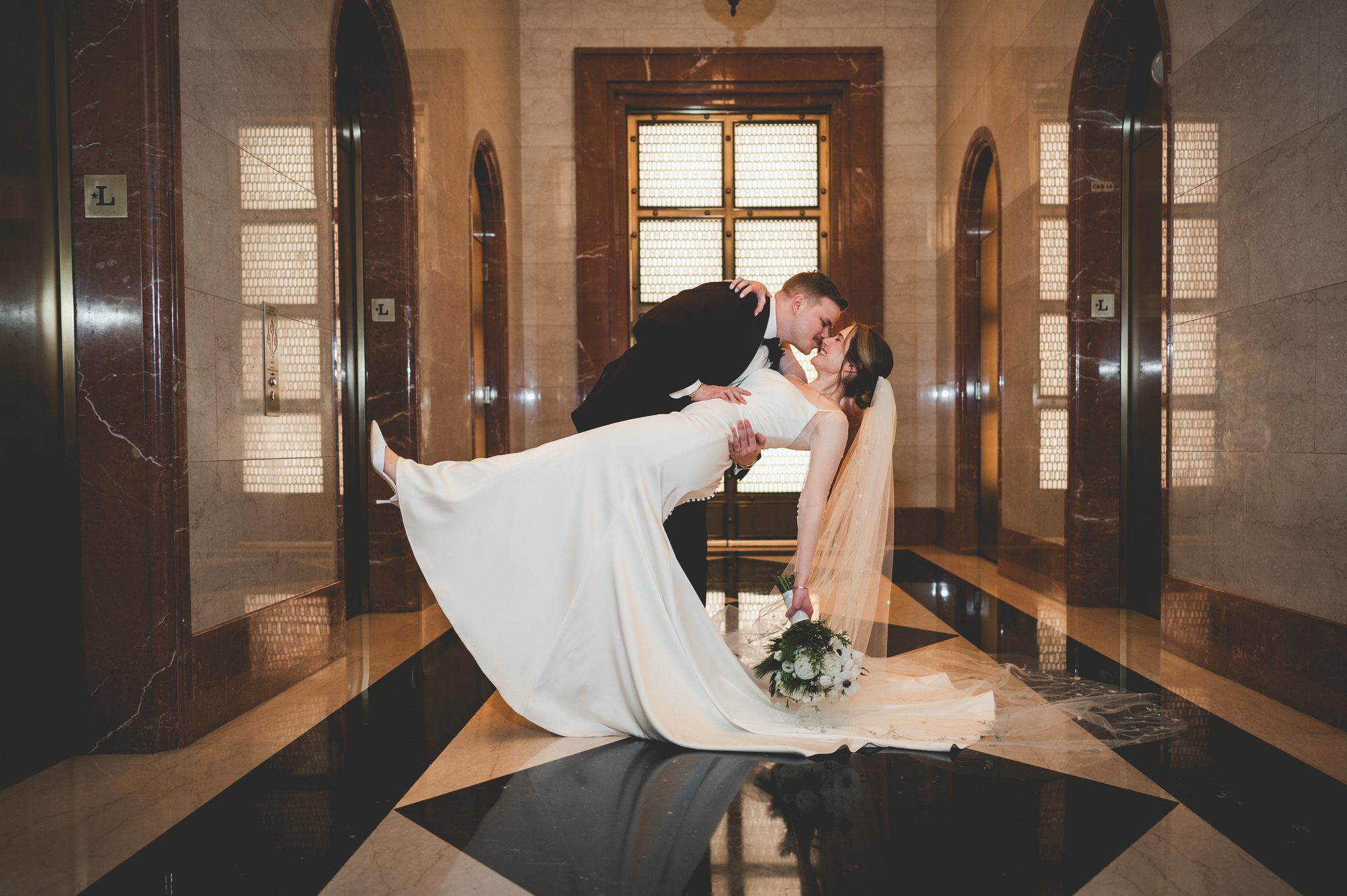 A couple beneath the marble arches