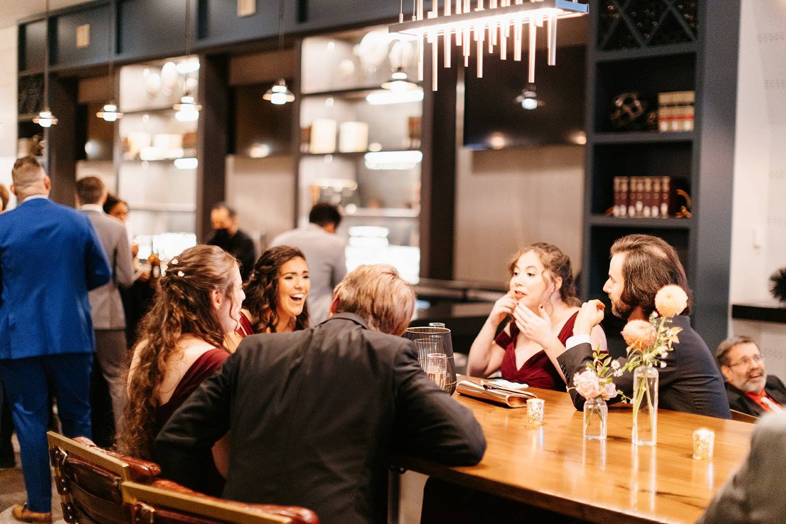 Guests talking around the long communal table