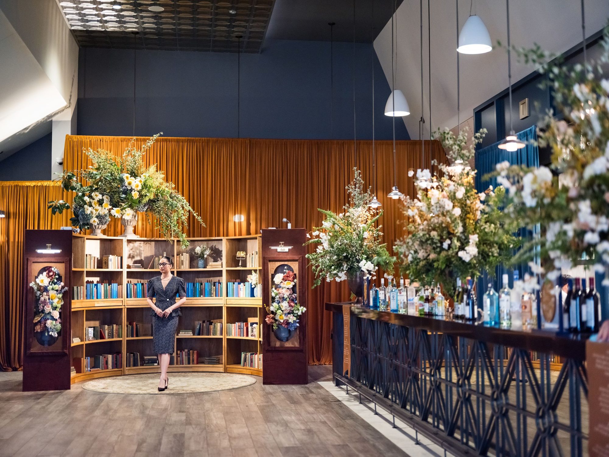 The bar dressed with large floral arrangements