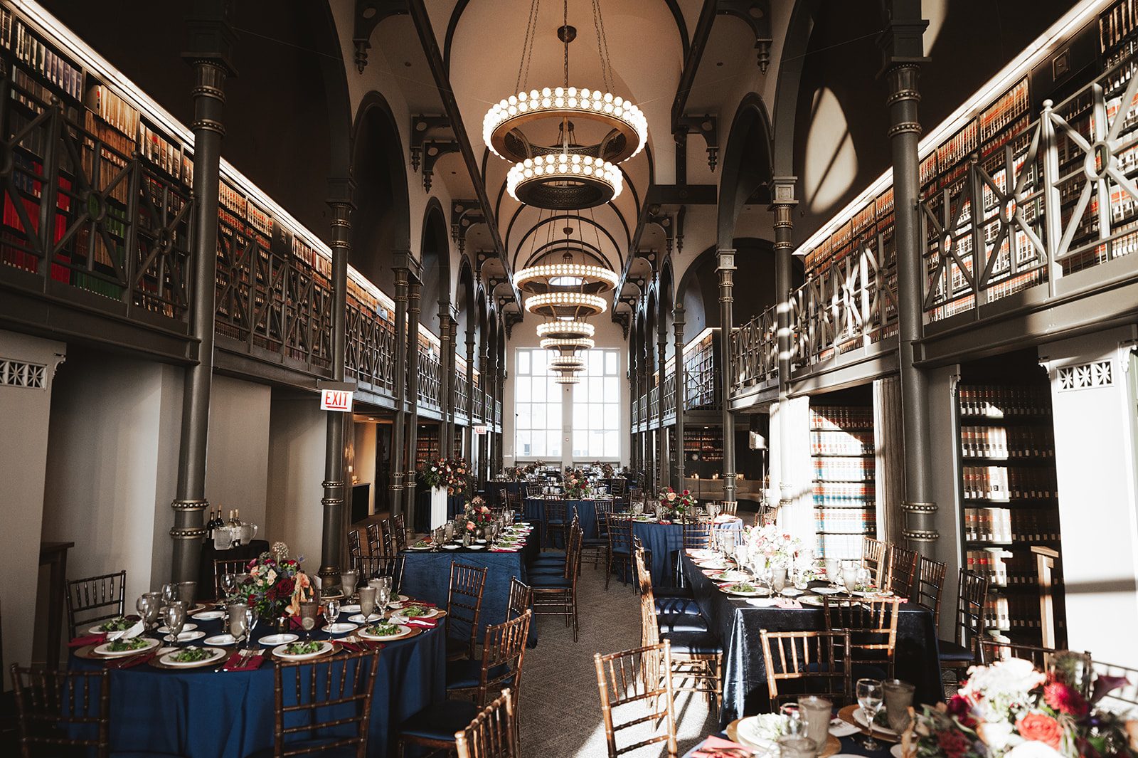 The Library set with round tables for a seated dinner
