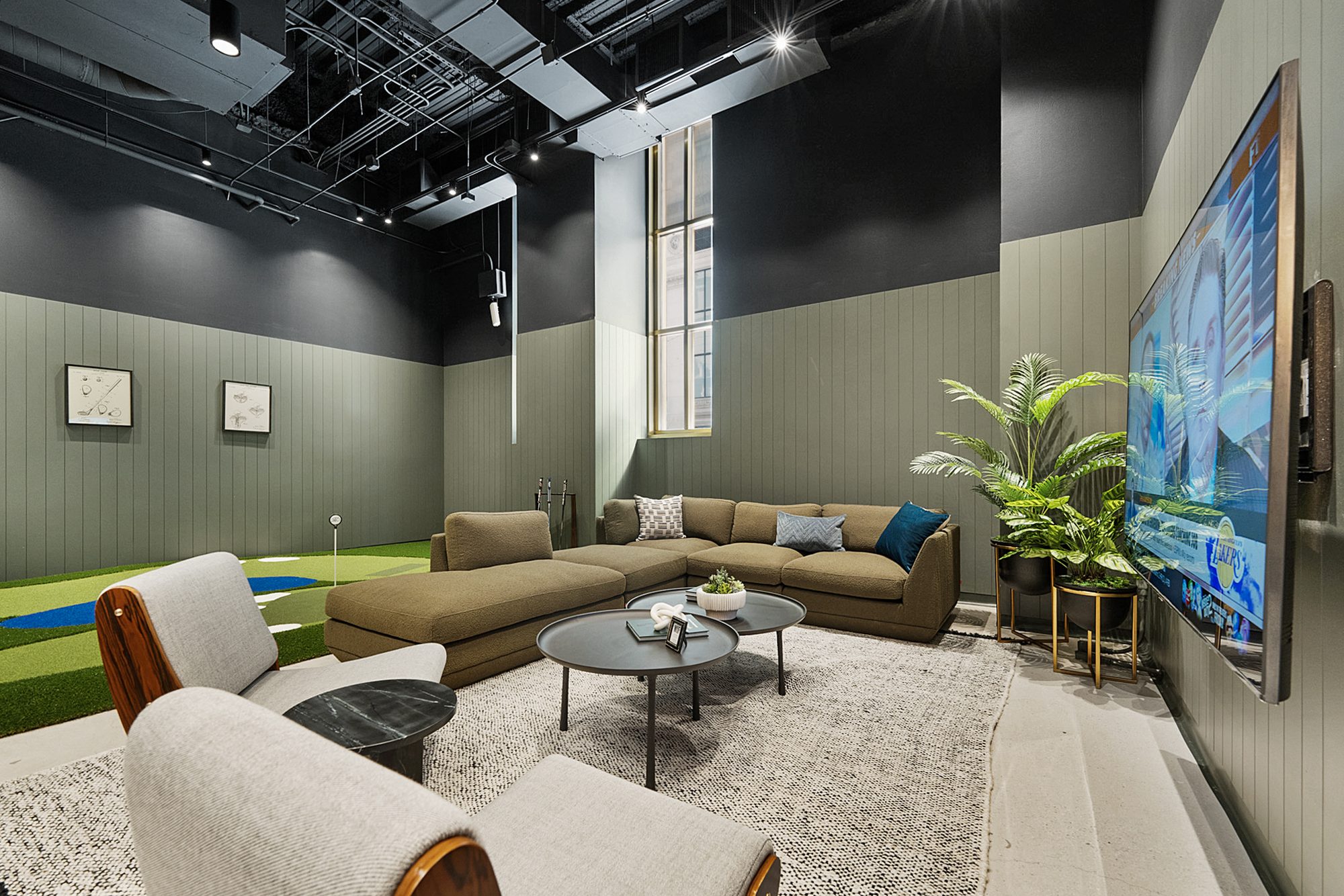 Lounge seating and a screen at The 19th Hole