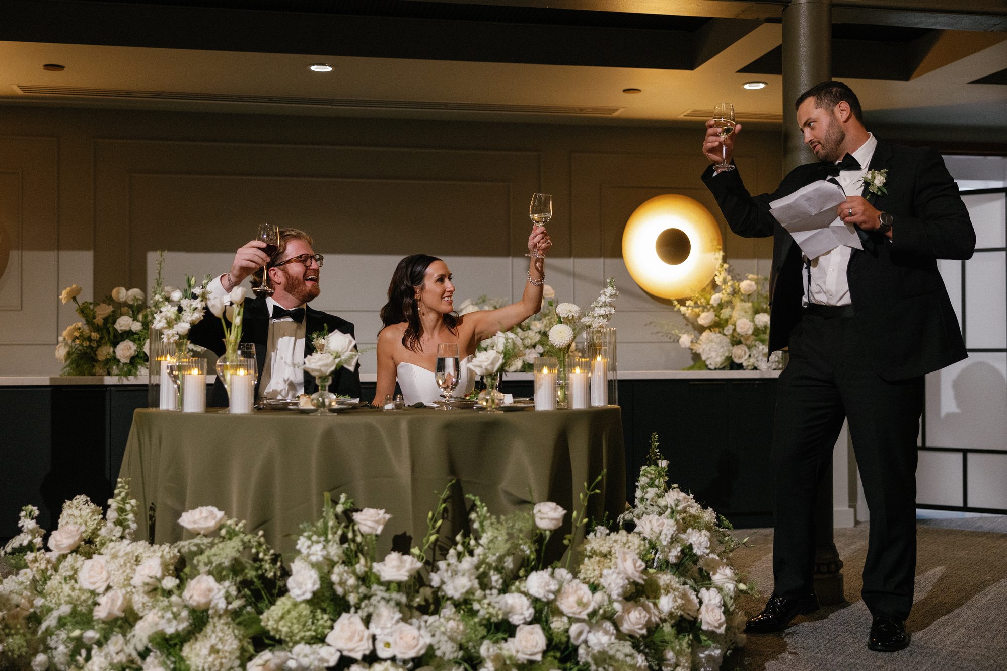 Guests raising a toast during the reception speeches